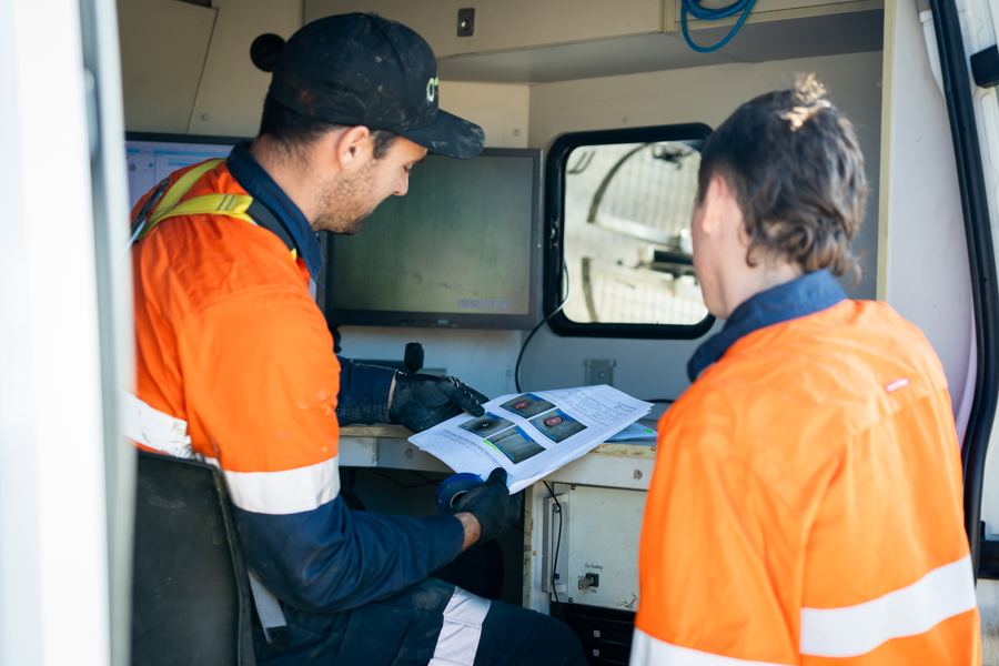 KBC crew reviewing a CCTV inspection report in the truck