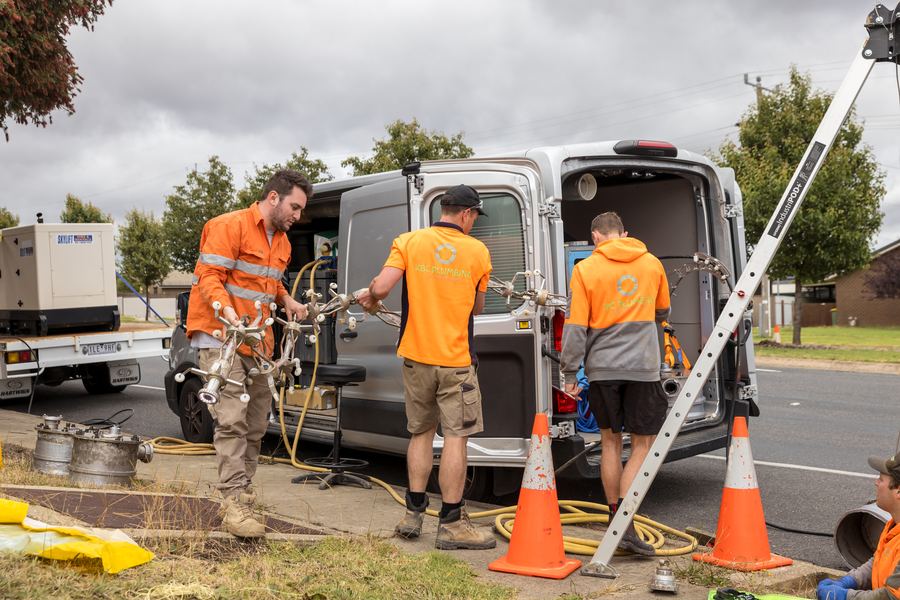 KBC crew unloading equipment from the service van